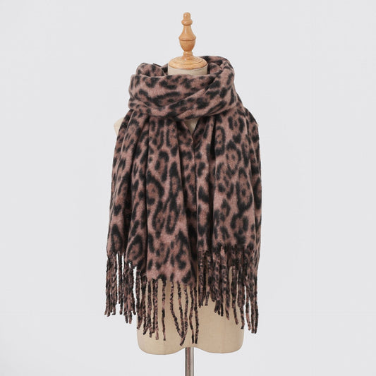 Mauve-brown leopard-print scarf with long fringe on a mannequin