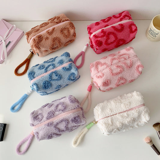 Fuzzy heart-pattern makeup bags in six colours with loop wrist straps