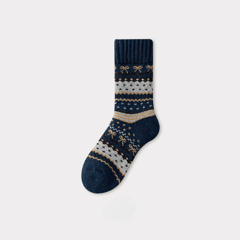 Single navy blue Nordic woolen sock with traditional white, brown, and gold patterns.
