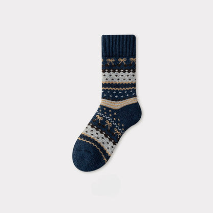 Single navy blue Nordic woolen sock with traditional white, brown, and gold patterns.