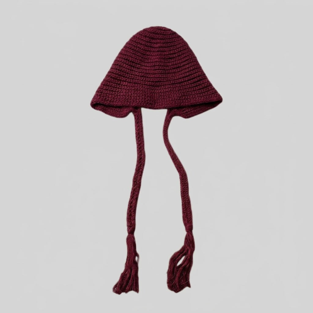 Burgundy bell-shaped knitted hat with long tasselled ties