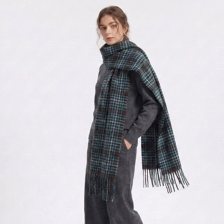 Woman wearing the green houndstooth scarf draped over one shoulder