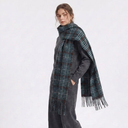 Woman wearing the green houndstooth scarf draped over one shoulder