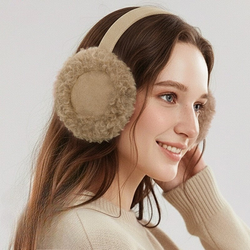 Woman wearing the khaki earmuffs with curly teddy plush muffs