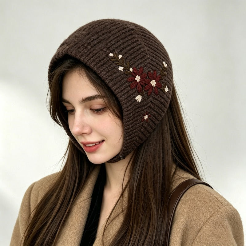 Woman wearing the coffee brown knitted headscarf with red floral embroidery