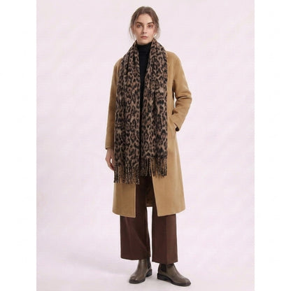 Full-length view of a woman wearing the leopard-print scarf with a camel coat