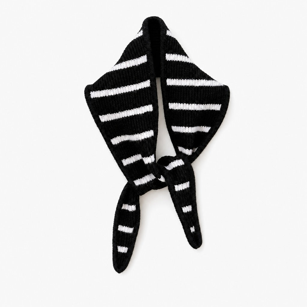 Black triangle scarf with cream stripes, knotted, on a white background