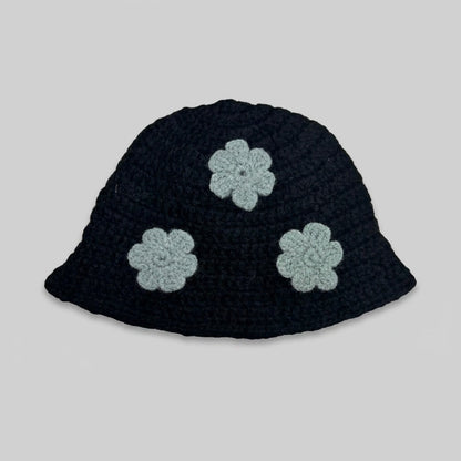 Black knitted bucket hat with three pale grey flower appliqués