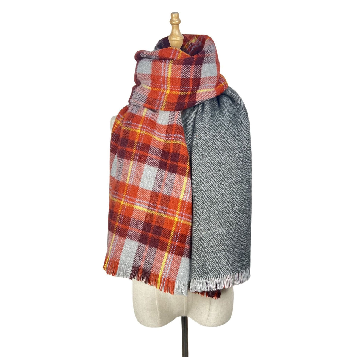 Red plaid scarf with grey reverse wrapped on a mannequin