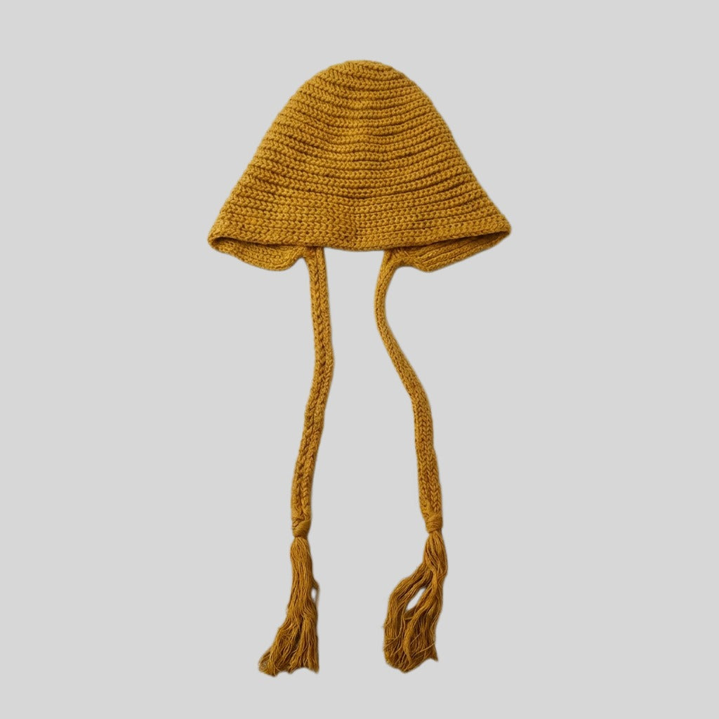 Mustard yellow bell-shaped knitted hat with long tasselled ties