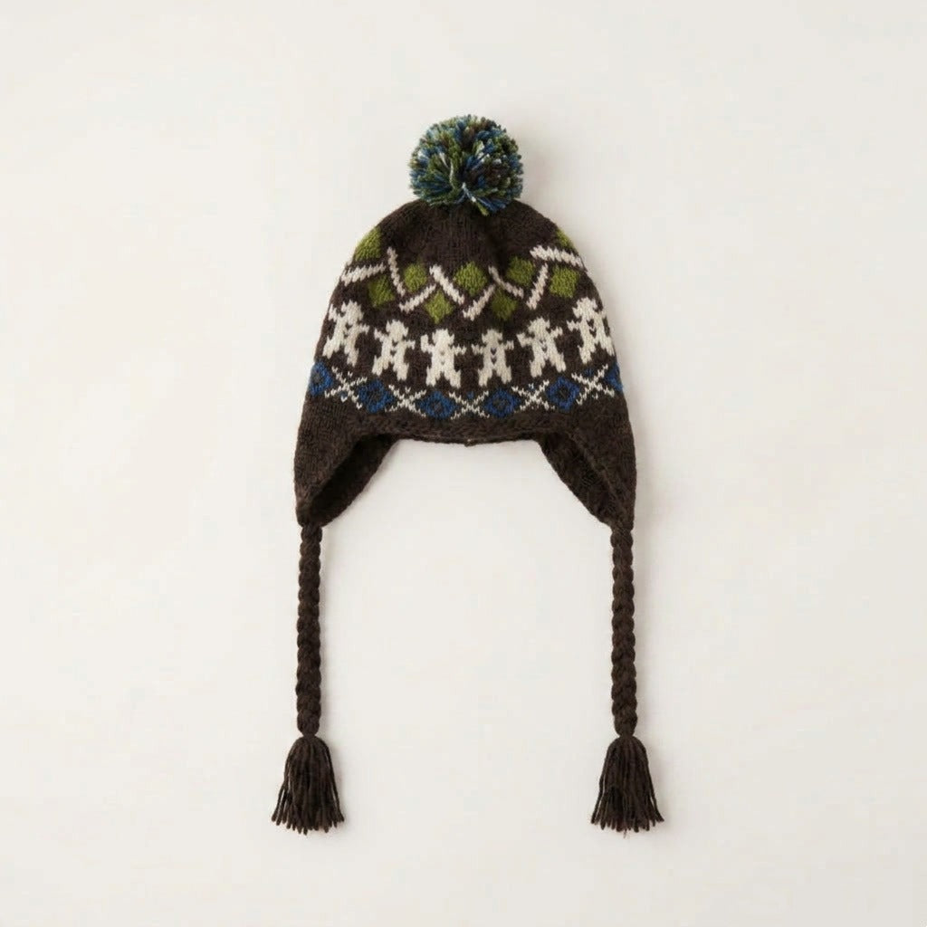 Brown gingerbread man ear-flap hat with green zigzag band, laid flat
