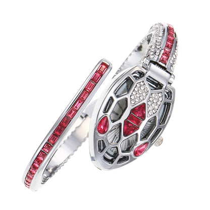 Silver snake-head bangle watch set with red crystals