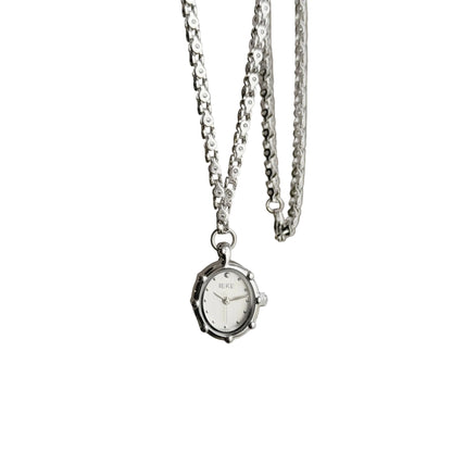 Silver oval pendant watch with a white dial and beaded bezel