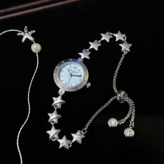 Women's star bracelet watch with Roman-numeral bezel