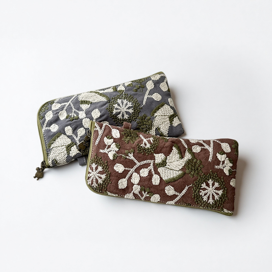 Two embroidered glasses cases in grey and brown with white leaf and flower embroidery