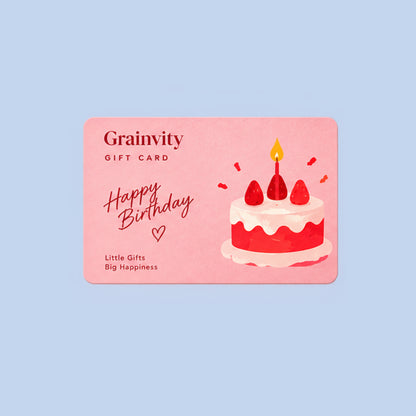 Grainvity Happy Birthday e-gift card design with a red and cream strawberry cake illustration, shown on a light blue background