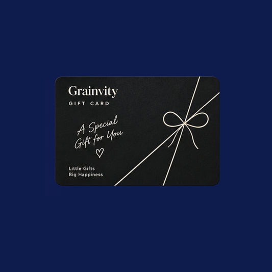 Black Grainvity gift card with "A Special Gift for You" script and a white ribbon bow, on a navy background
