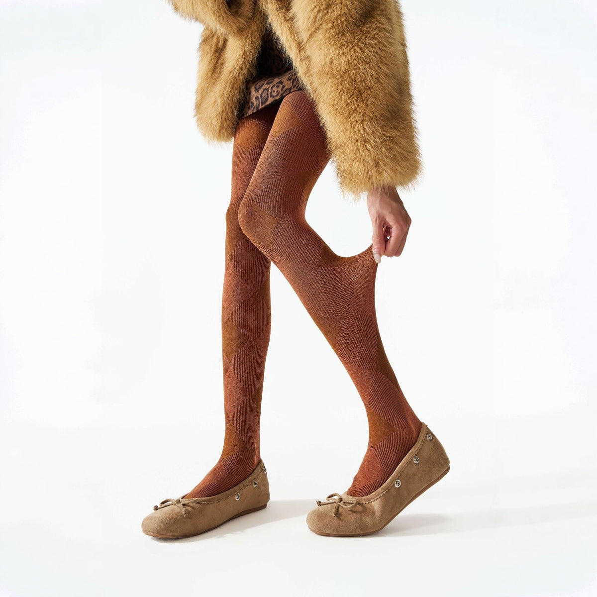 Plaid thermal tights in brown, worn with tan ballet flats and a fluffy coat