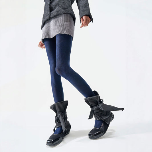 Plaid thermal tights in navy, worn with black tie-up boots