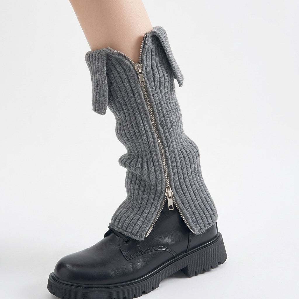 Grey side-zip leg warmers worn over black lace-up boots