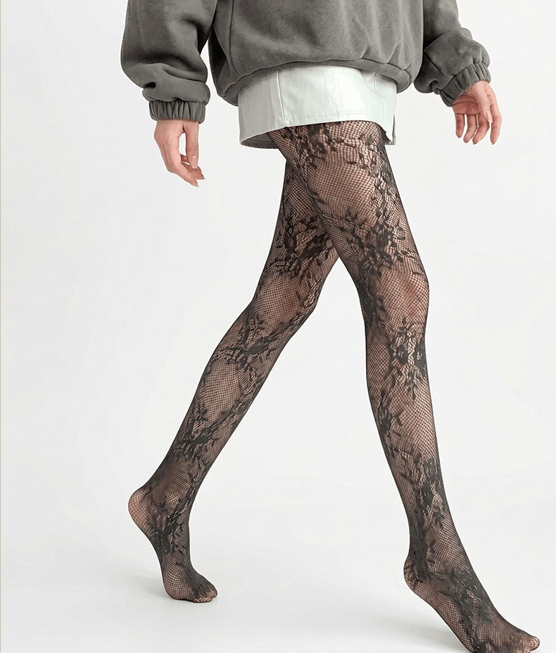 Vintage rose lace ultra-sheer tights in black, side view showing the floral lace pattern