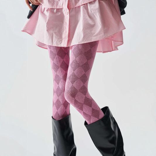 Women's tartan thermal tights in pink with a diamond check pattern, worn with black knee-high boots